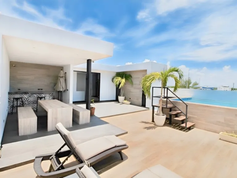 Sunny terrace with relaxing ocean views Sunny terrace with sun loungers and ocean view in Playa del Carmen