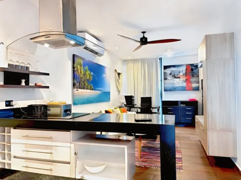 Stylish open-plan kitchen with breakfast bar Modern open-plan kitchen with breakfast bar in Playa del Carmen vacation apartment